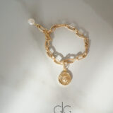 Stainless steel bracelet with freshwater pearl and sun symbol - GG UNIQUE