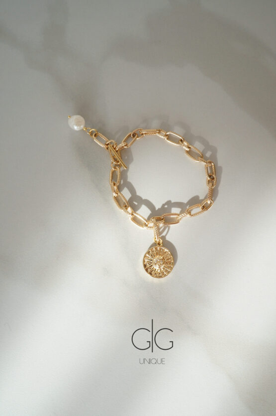 Stainless steel bracelet with freshwater pearl and sun symbol - GG UNIQUE