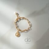 Stainless steel bracelet with freshwater pearl and sun symbol - GG UNIQUE
