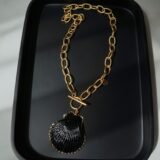 Natural massive shell necklace covered in a black and gold - GG UNIQUE