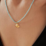 Blue necklace with gold shell - GG Unique