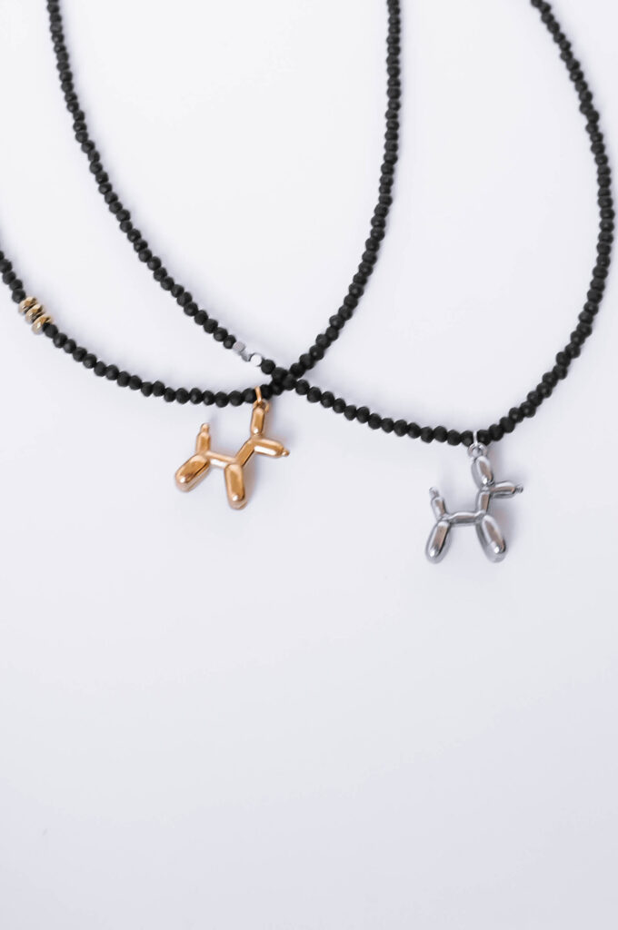 balloon dog necklace in silver and gold