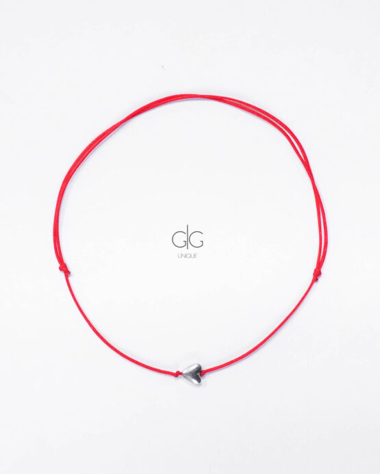 Red string with heart