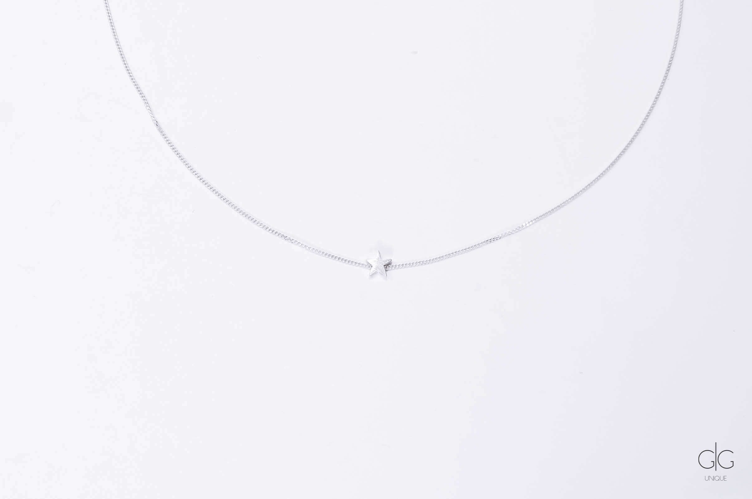Minimal silver necklace with a star