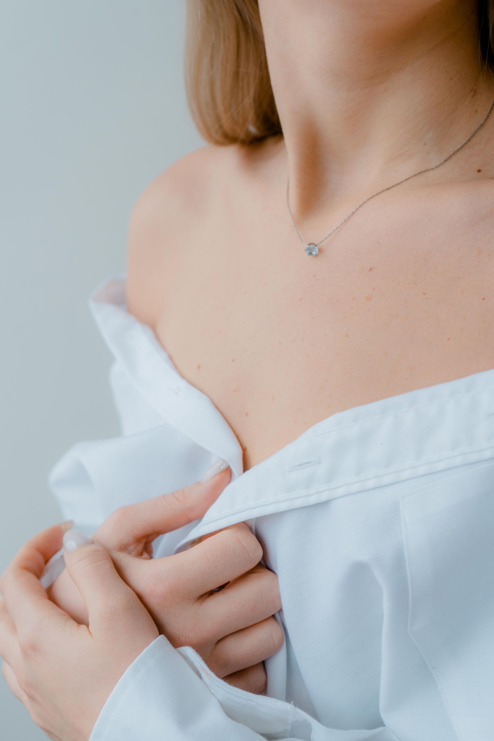 Delicate minimalist necklace worn on bare skin