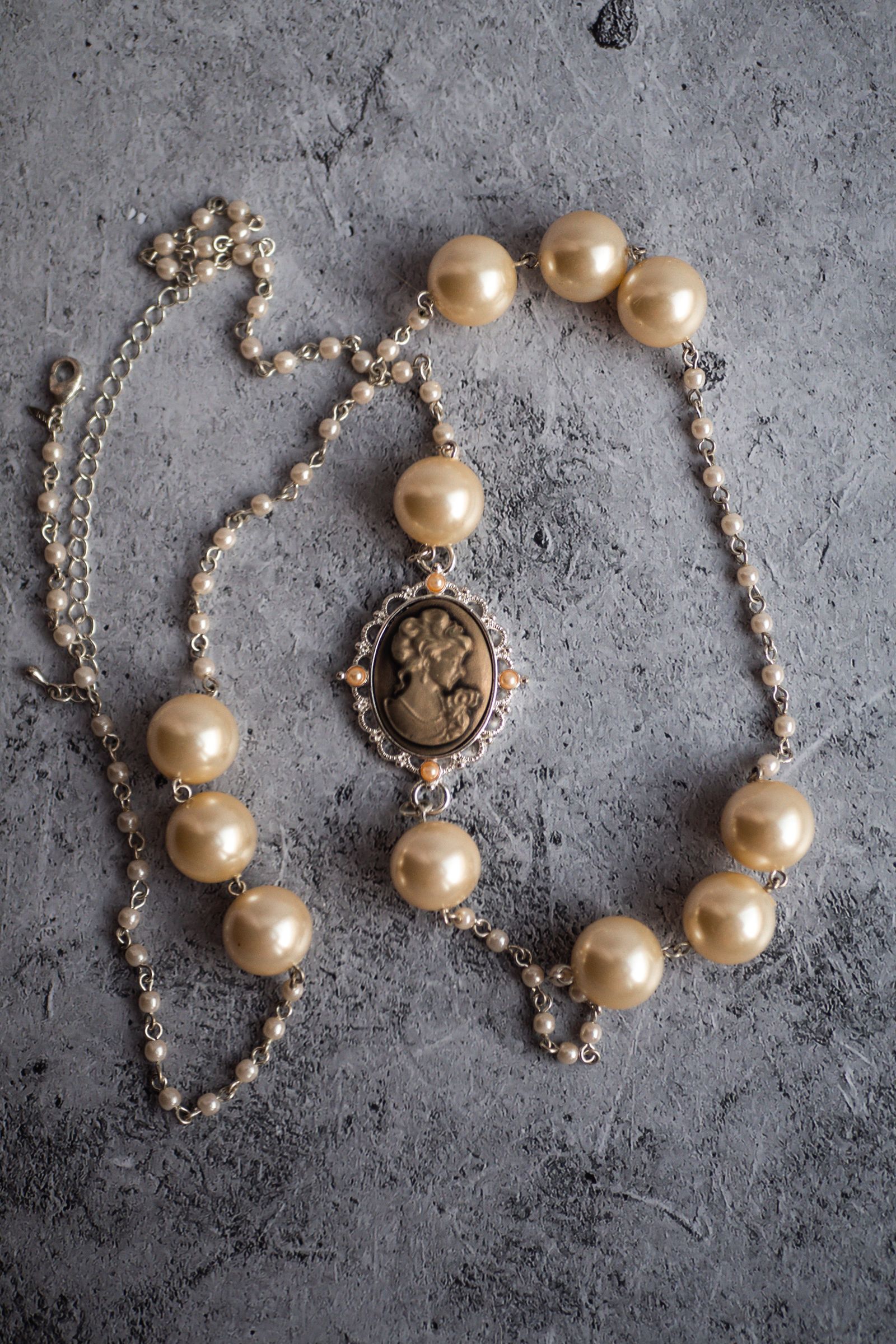 Vintage cameo pendant on a necklace with oversized pearls